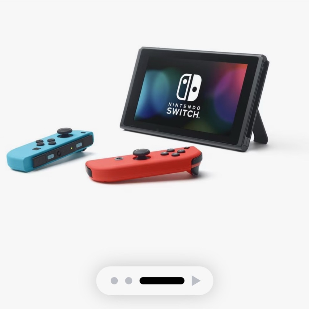 Nintendo Console with Red and Blue Controllers